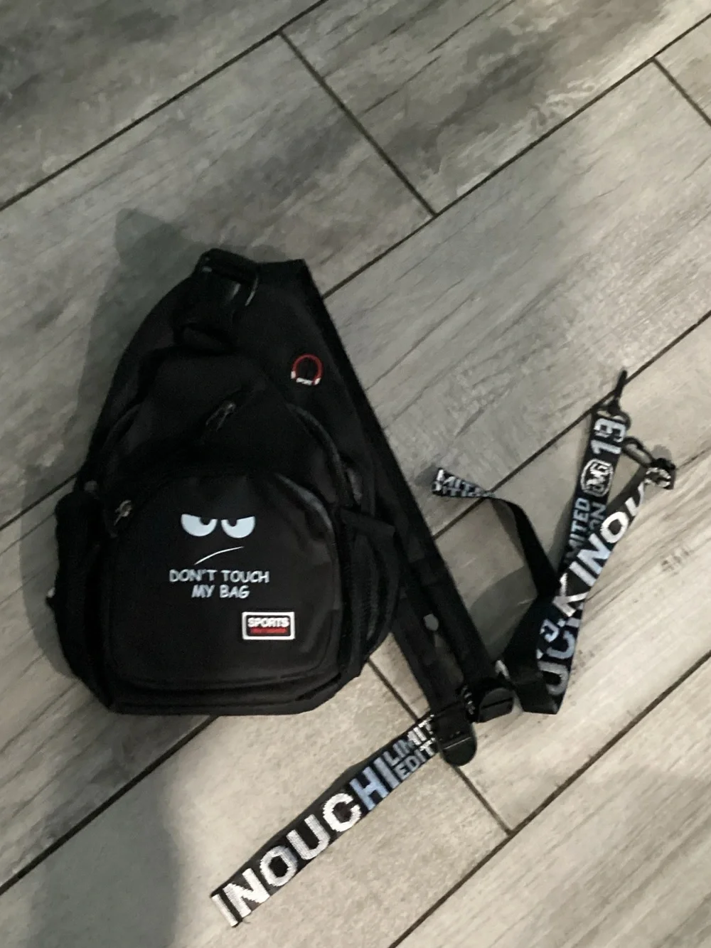 Black Sling Backpack with 'Don't Touch My Bag' Graphic